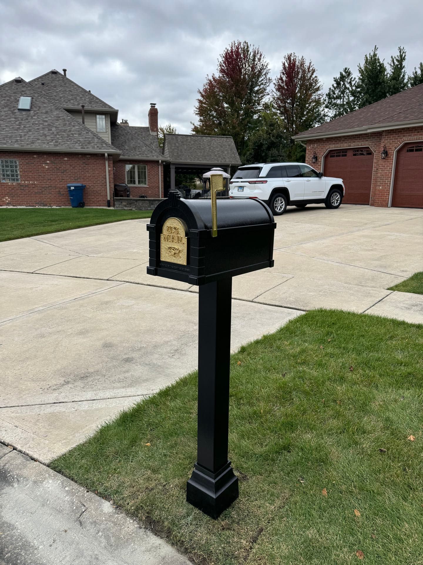 Newly installed black post-mounted mailbox in Chicago suburb
