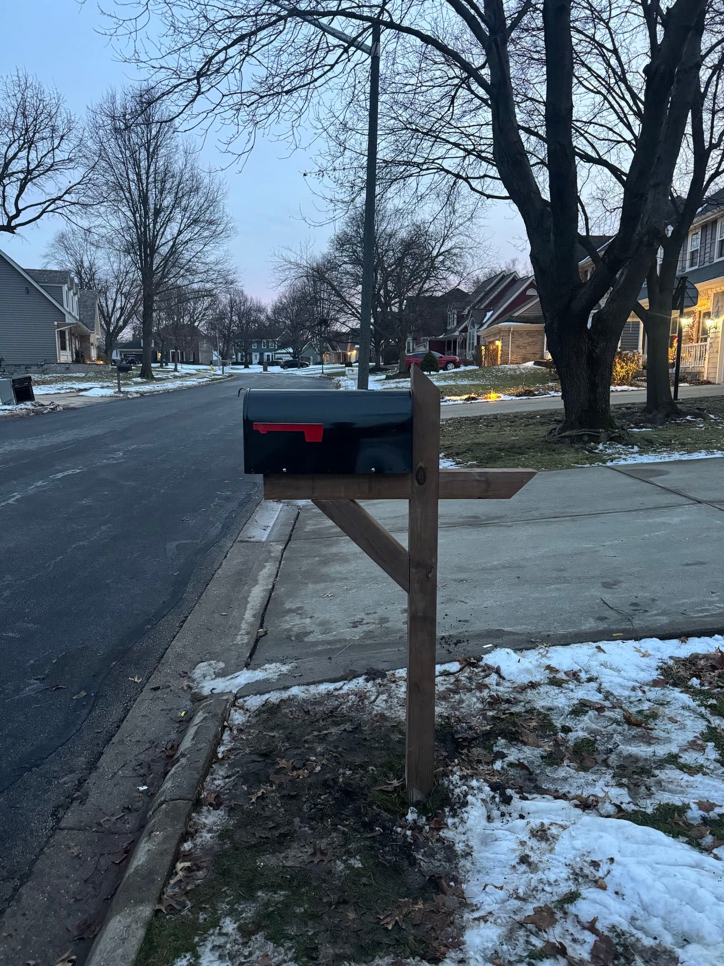 Brown mailbox with ornate base installed in Hinsdale, IL