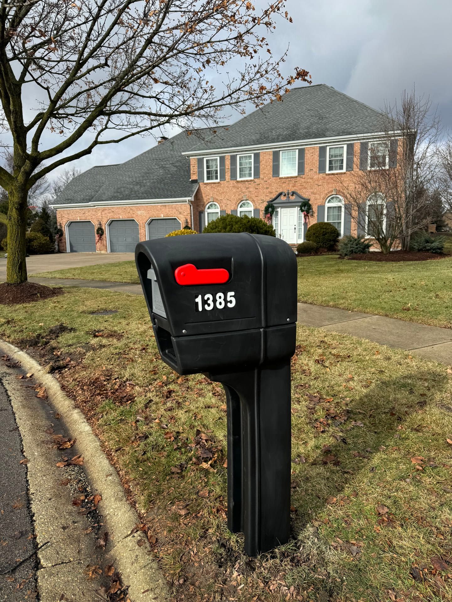 White mailbox with black trim installed in Lisle, IL