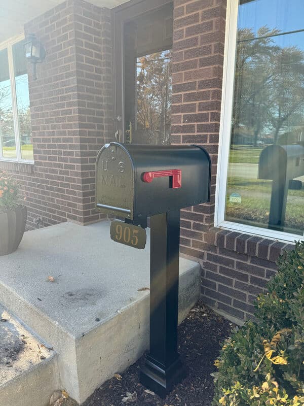 Premium black Keystone mailbox with decorative post installed in Downers Grove